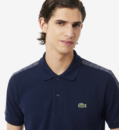 Lacoste Men's Slim Fit Branded Tape Piqué Polo Shirt – Navy Blue
